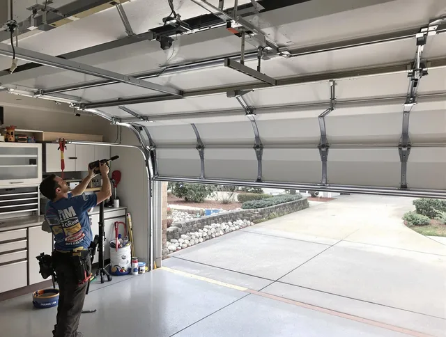 Garage door track repair service by Clinton Garage Door Repair in Clinton